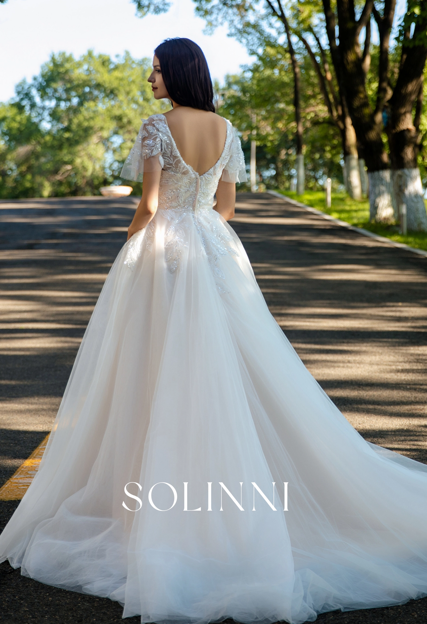 Graceful A-Line Tulle Wedding Dress with Delicate Lace and Removable Sleeves