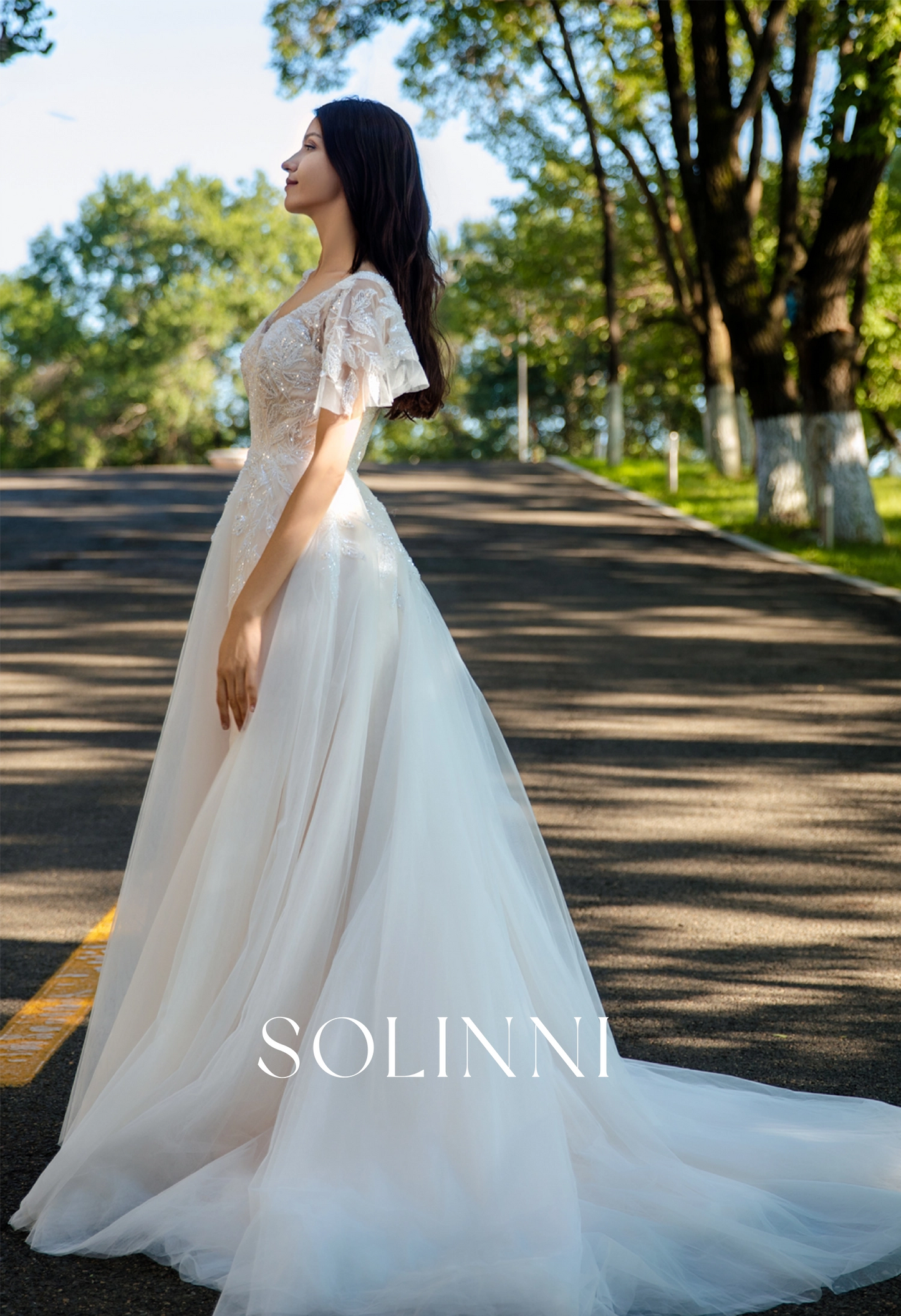 Graceful A-Line Tulle Wedding Dress with Delicate Lace and Removable Sleeves