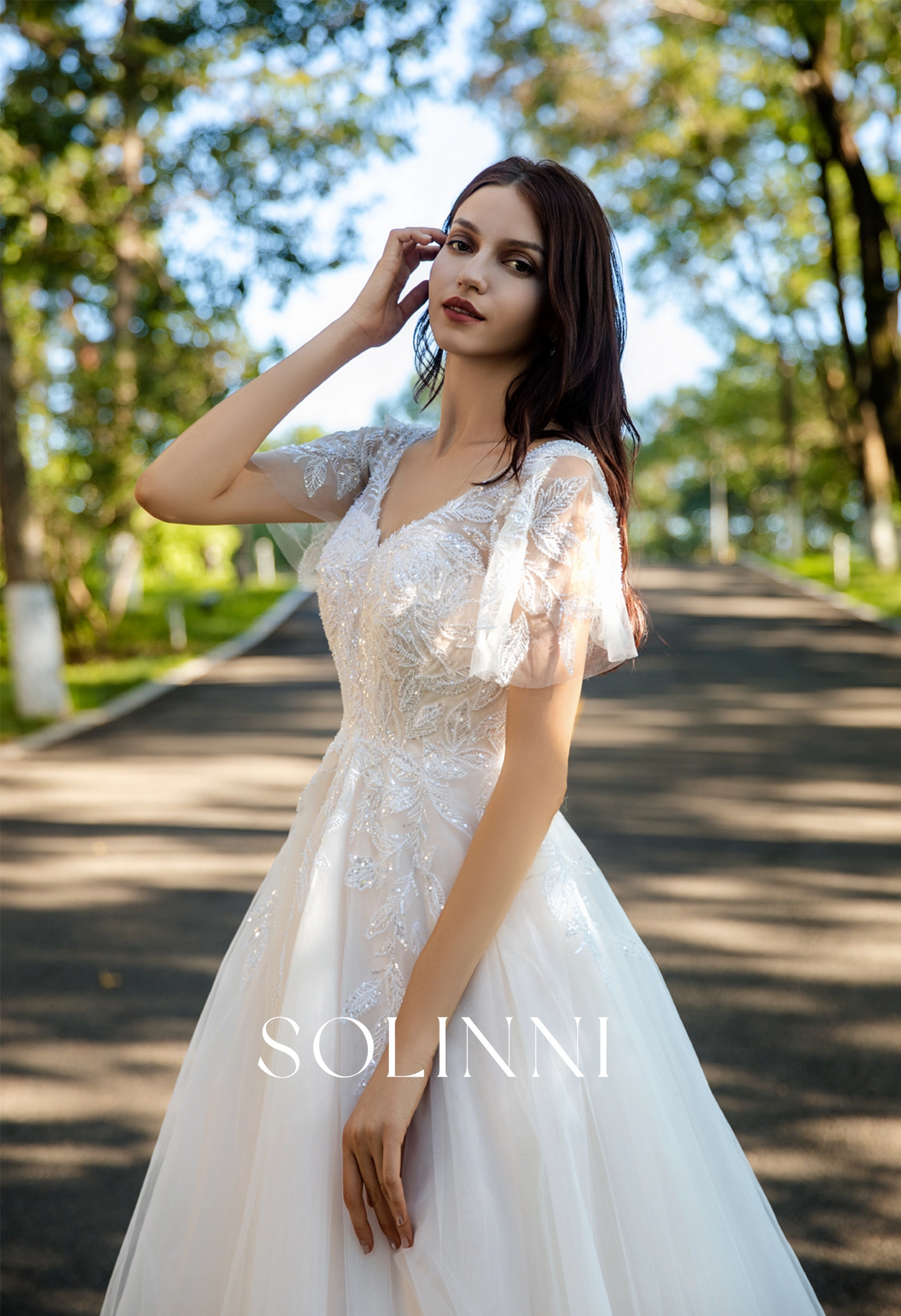 Graceful A-Line Tulle Wedding Dress with Delicate Lace and Removable Sleeves