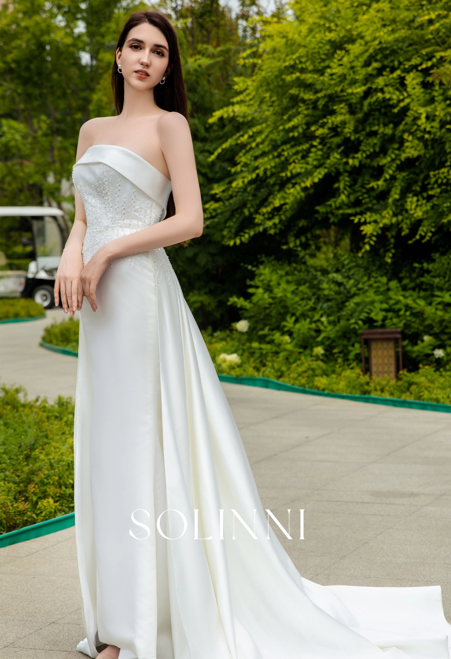 Sleek Satin Bridal Gown with Pearl-Embellished Waist and Sweep Train