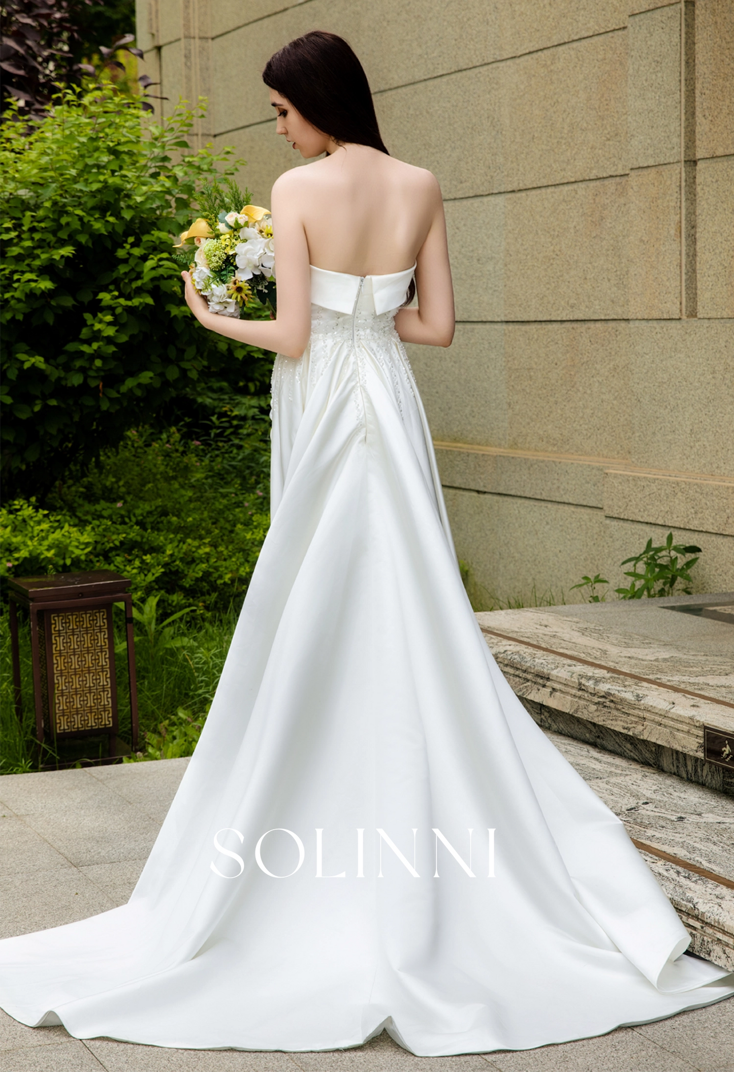 Sleek Satin Bridal Gown with Pearl-Embellished Waist and Sweep Train