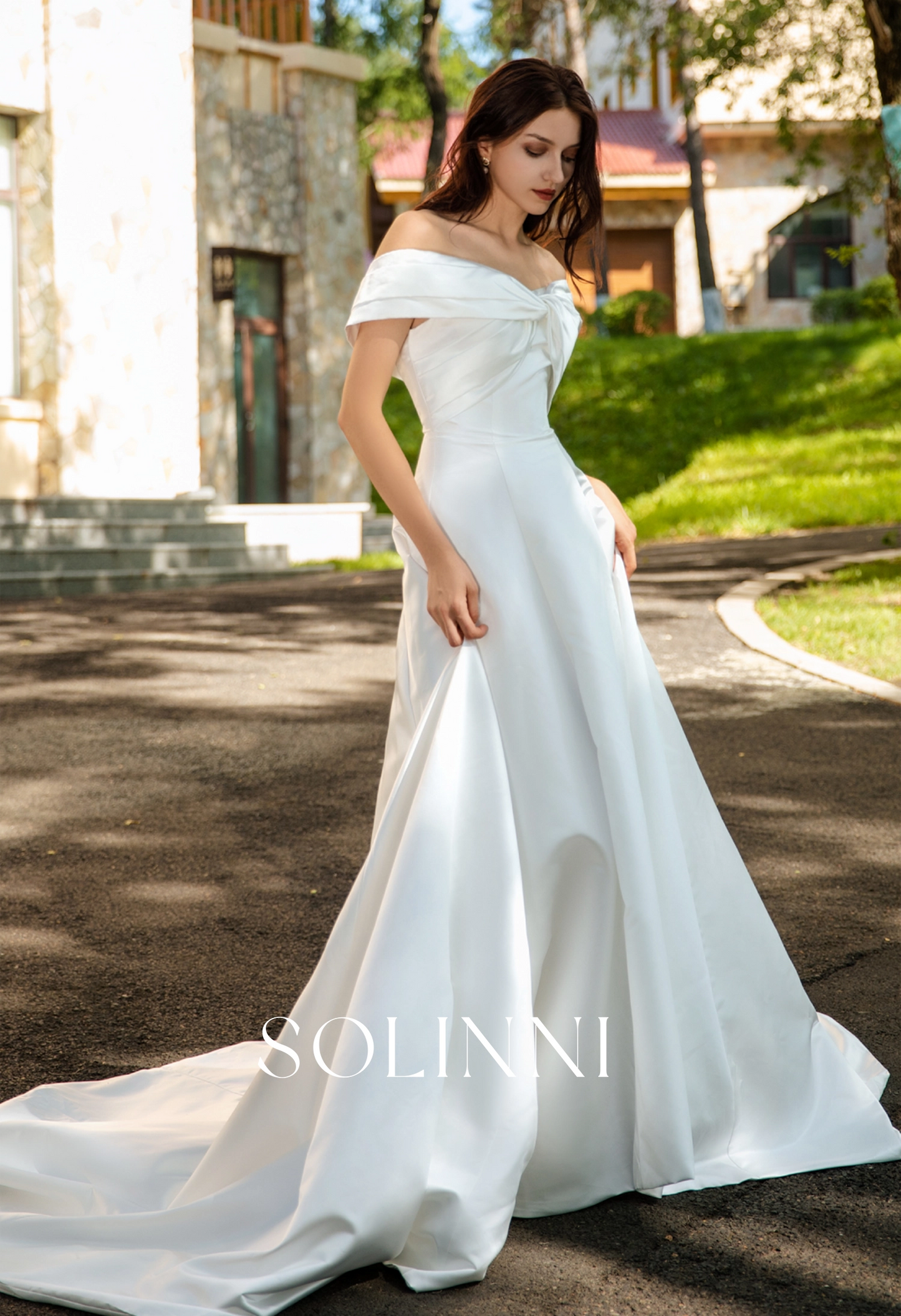 Waist-Enhancing Satin Bridal Gown with Bow Design