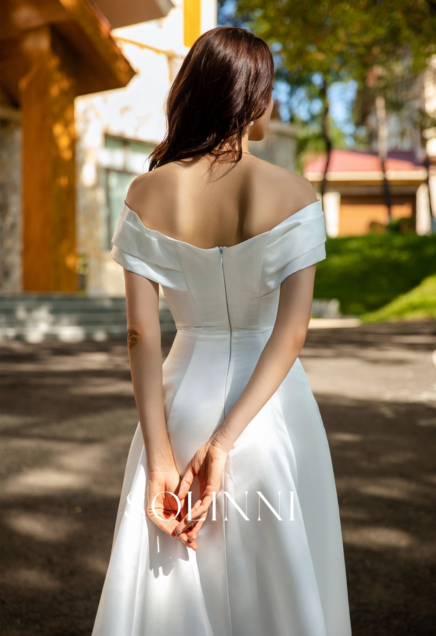 Waist-Enhancing Satin Bridal Gown with Bow Design