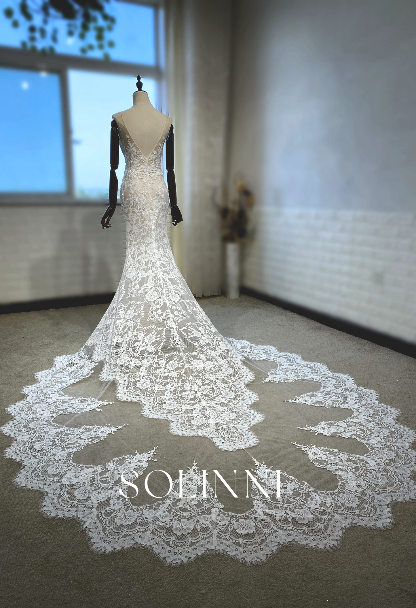 Intricate Lace Wedding Gown with Dramatic Train