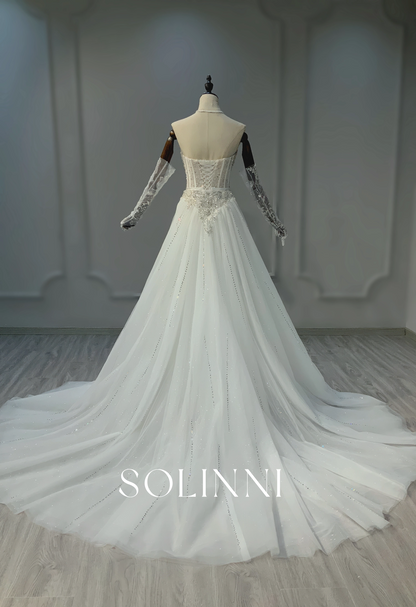 Dazzling Beaded Wedding Gown with Intricate Embroidery and Sheer Detailing